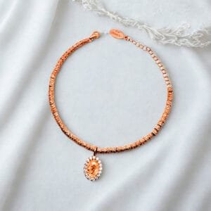 Bracciale con pepite e medaglia PADRE PIO in argento 925 rosè con zirconi bianchi.